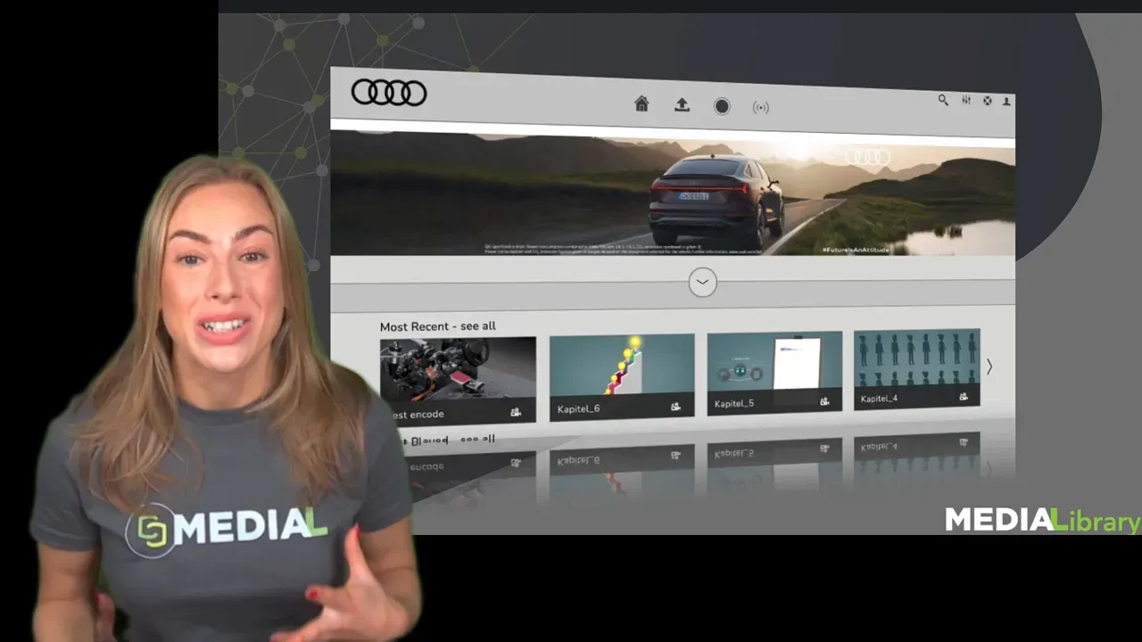 Presenter in front of an Audi‑branded MEDIALibrary portal screenshot showing a car banner and media tiles